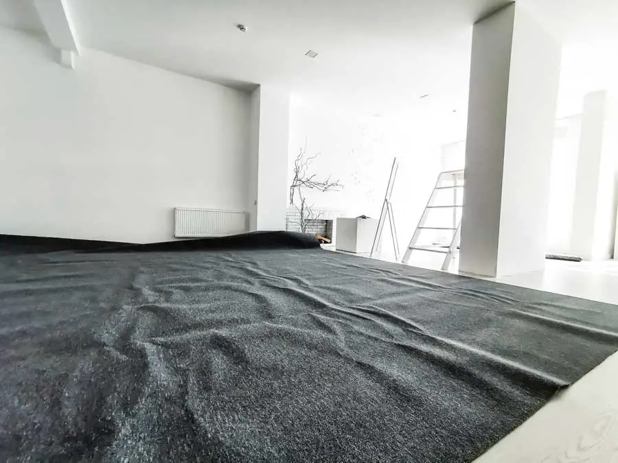 Carpet Ripples and Buckling