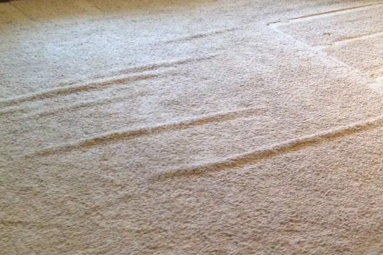 Carpet Ripples and Buckling