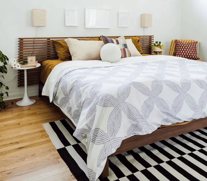 Rug Placement in Bedroom with Bed in Corner